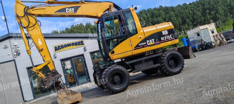 Caterpillar M313C gumikerekes forgókotró